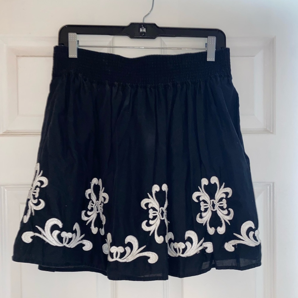 Cute black embroidered skirt.